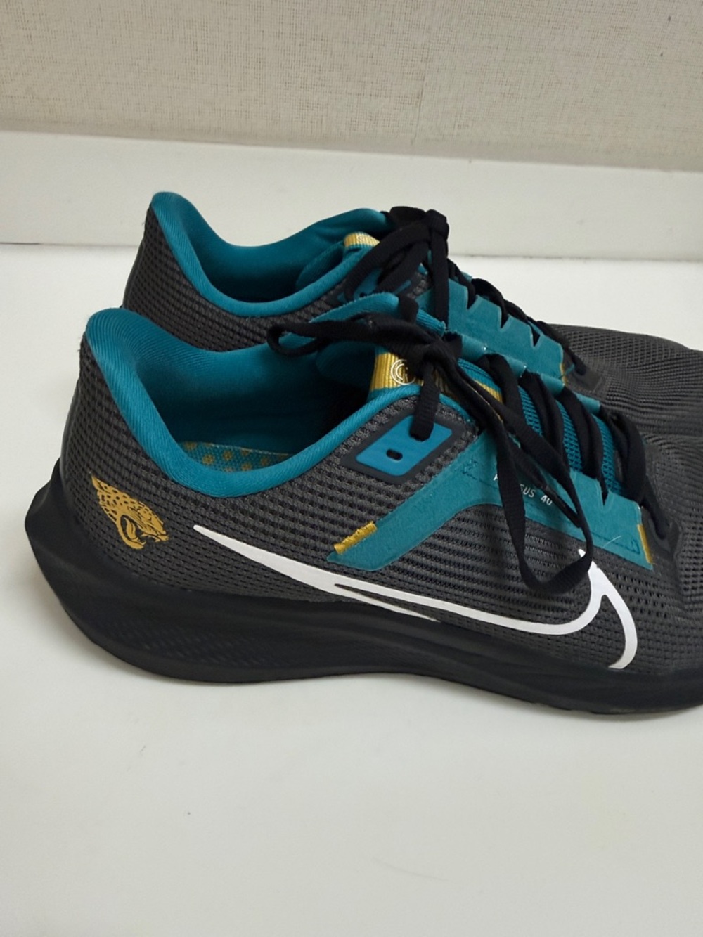 Nike Jacksonville Jaguar Pegasus 40 Athletic Sneakers with White Swoosh